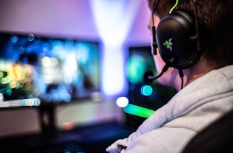 A friendly customer support agent wearing a headset, smiling and ready to assist gamers.