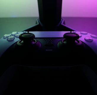 A sleek gaming controller resting on a vibrant gradient background with subtle glowing effects.